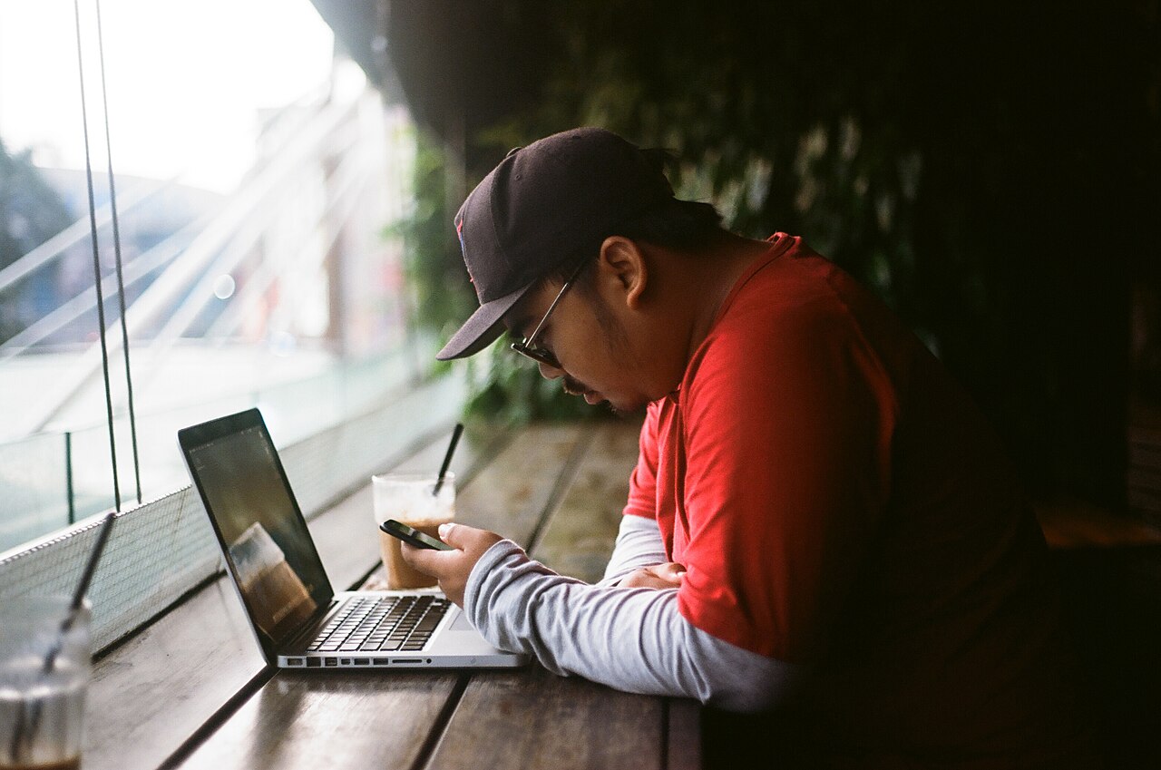 A person using a laptop at a desk